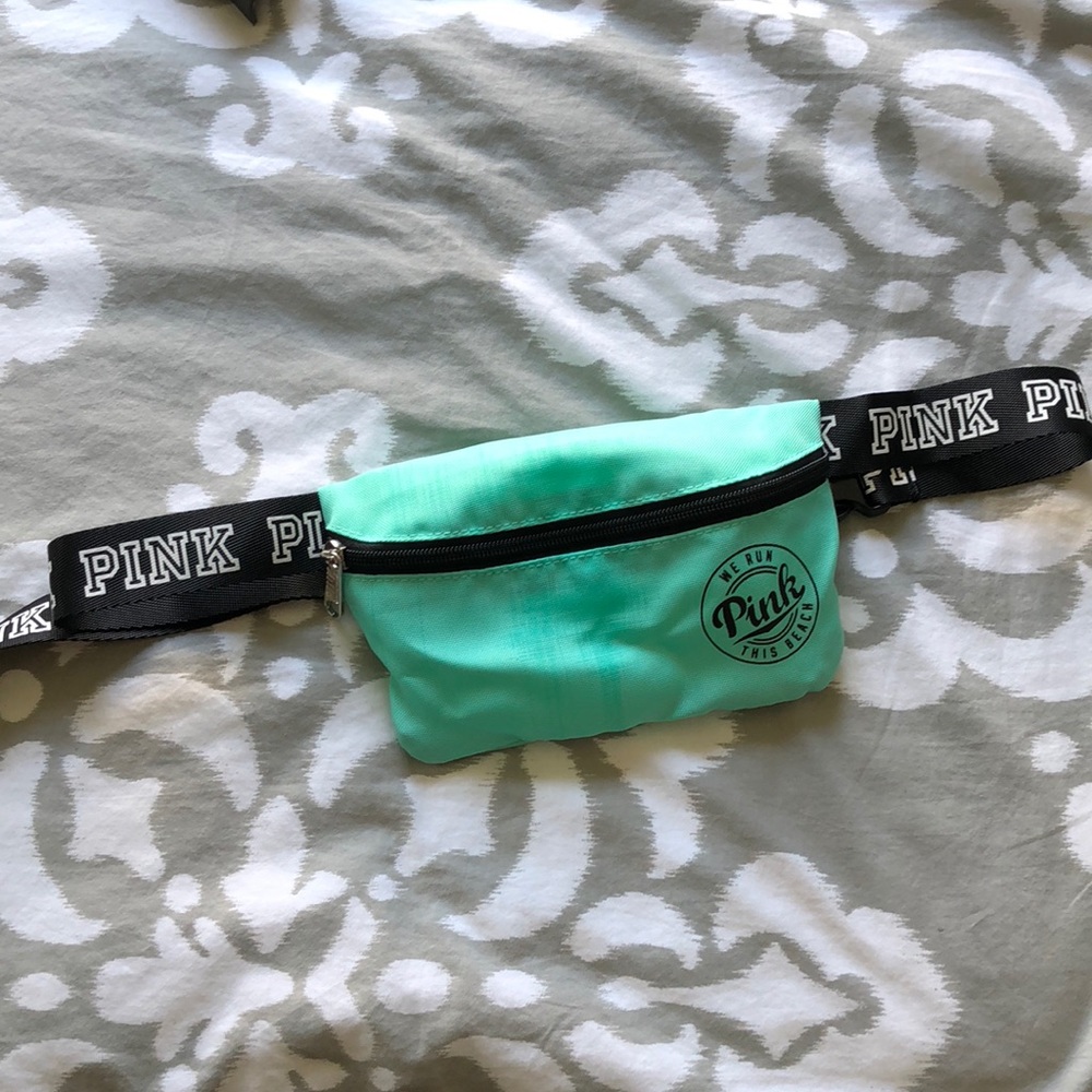 Pink “We run this beach” fanny pack in teal